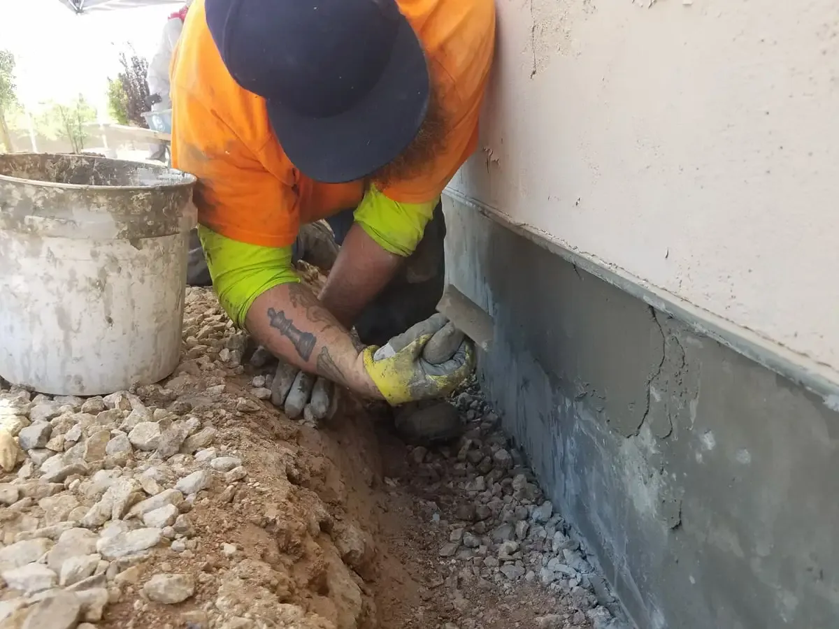 Professional foundation repair service on exterior wall – Foundation Pro Dallas